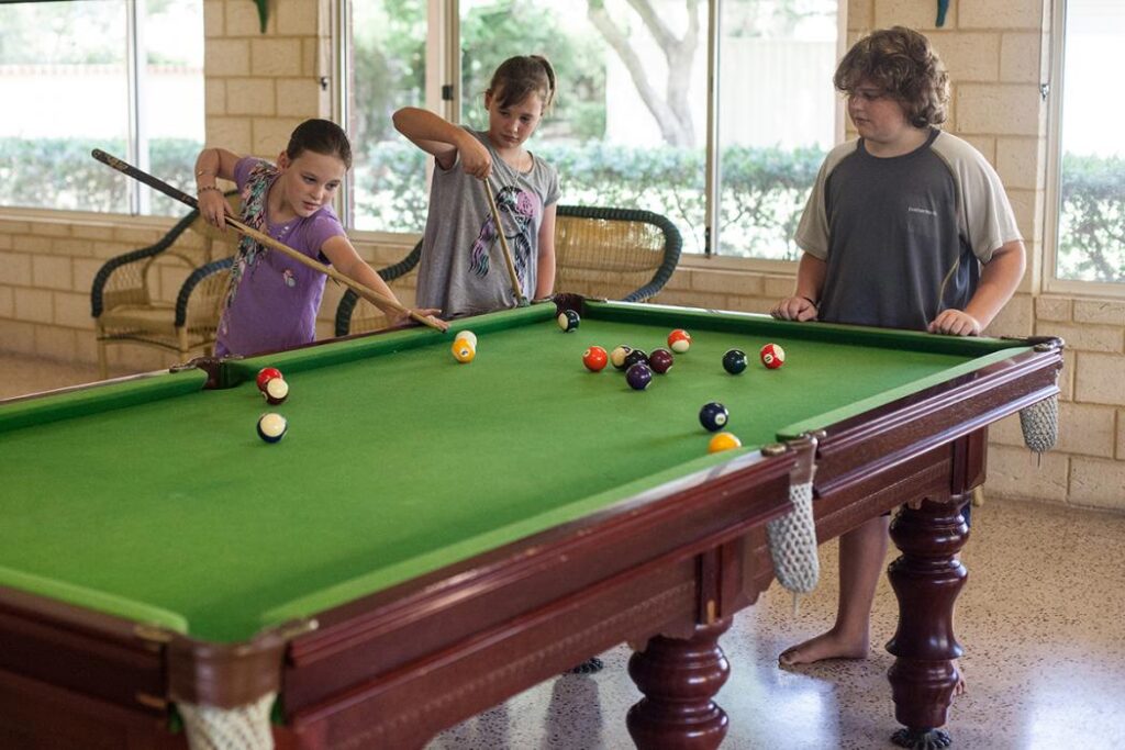 Kids playing billards